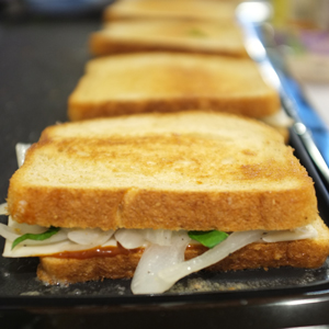 BBQ-Style Grilled Cheese with Caramelized Onions and Basil